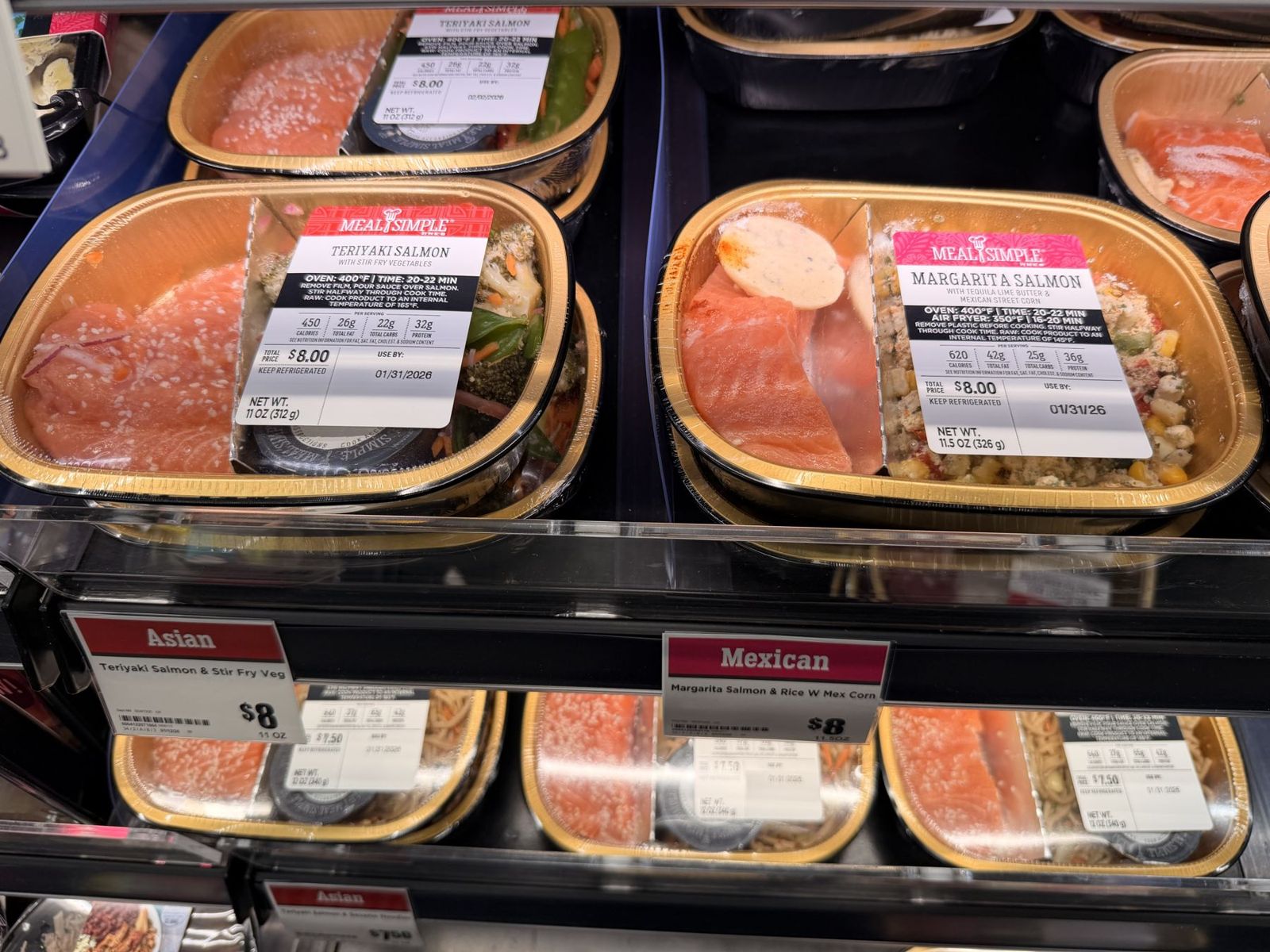 H-E-B oven-ready teriyaki salmon and margarita salmon meals with Asian and Mexican shelf tags