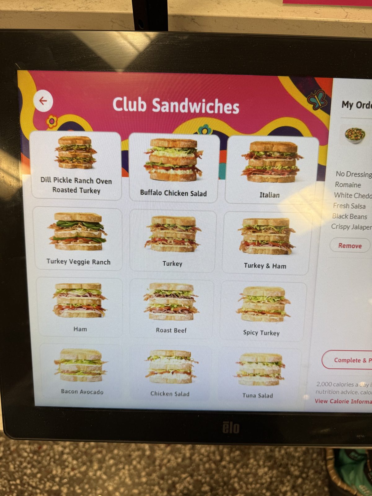 A Wawa ordering kiosk's club sandwich menu, led by a Dill Pickle Ranch Oven Roasted Turkey
